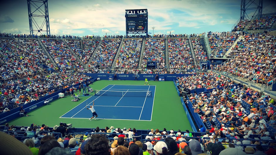 Thrilling tennis match at the US Open with a full stadium of enthusiastic fans.